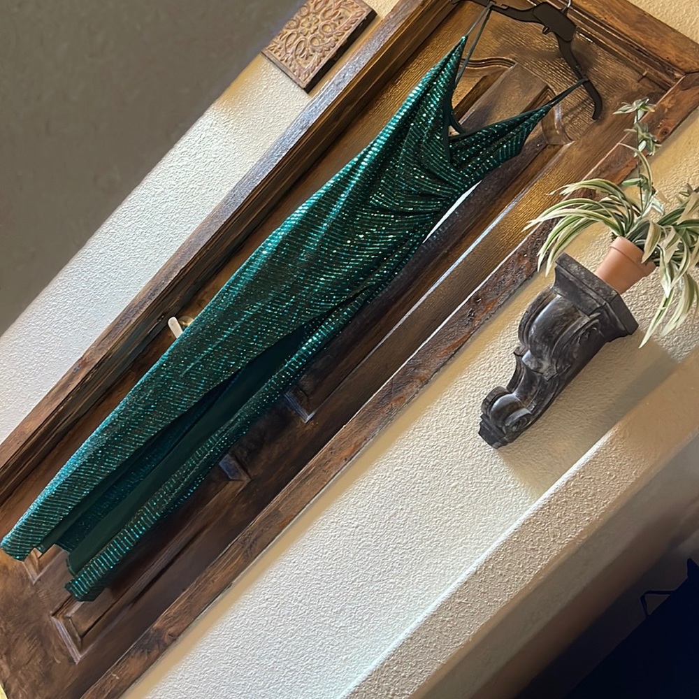Emerald green fitted prom dress with a slit on the left side